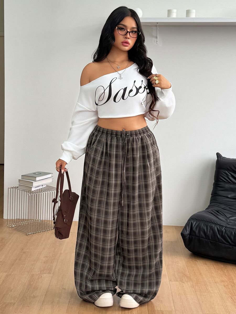 Women's loose straight leg cotton pants featuring a high waist with an adjustable drawstring knot and functional side pockets.