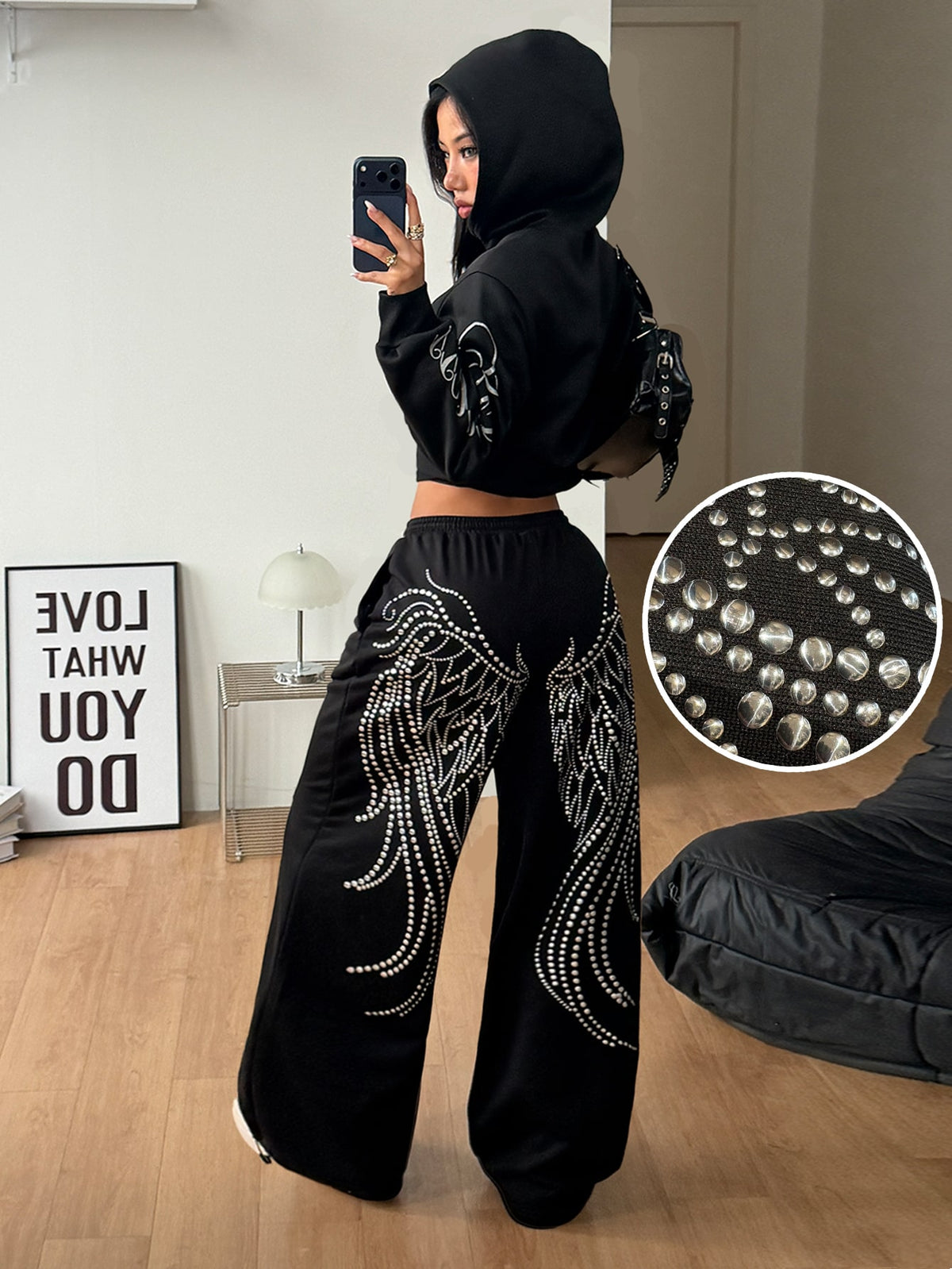 Women's loose fit wide leg graphic sweatpants in light grey with an elastic drawstring waistband