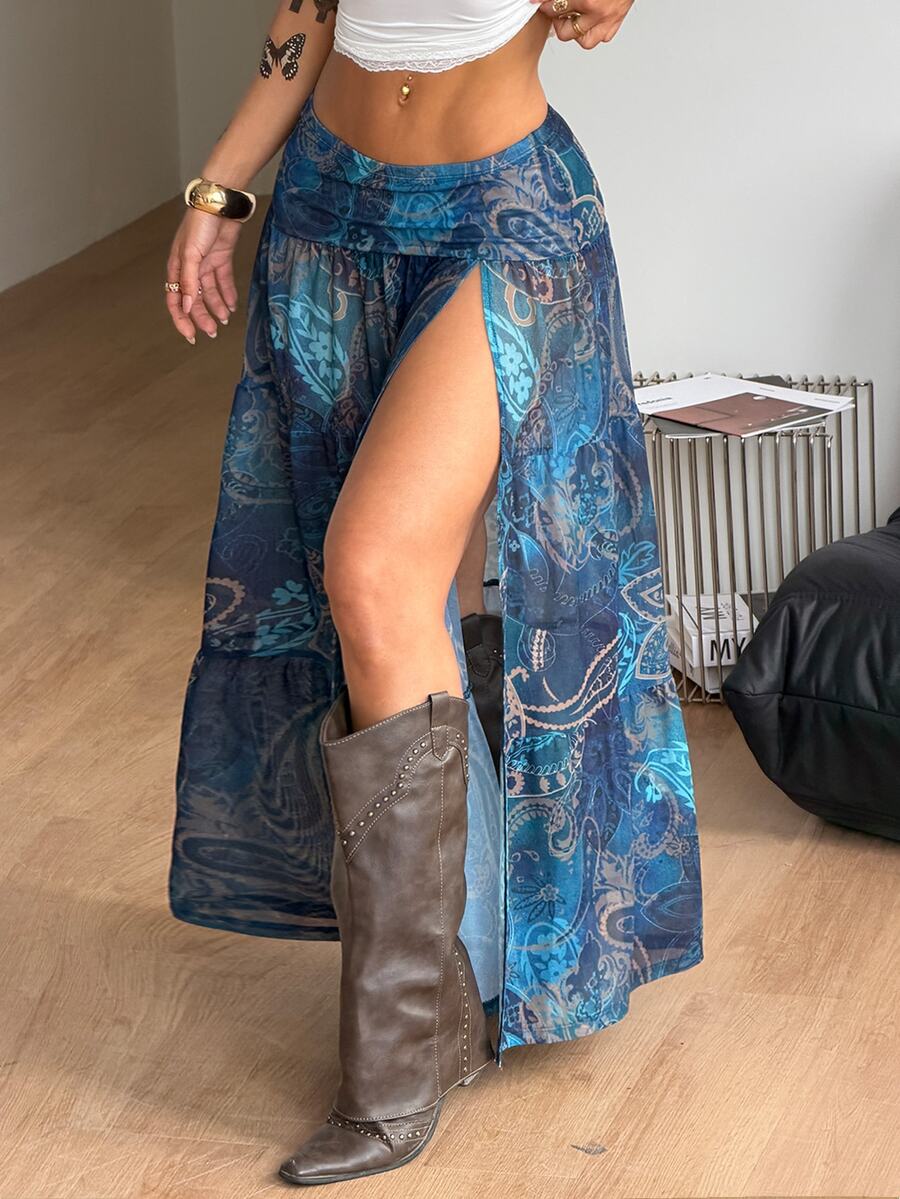 Women's low rise flared long skirt featuring an all-over print, split thigh accent, and textured semi-sheer fabric.