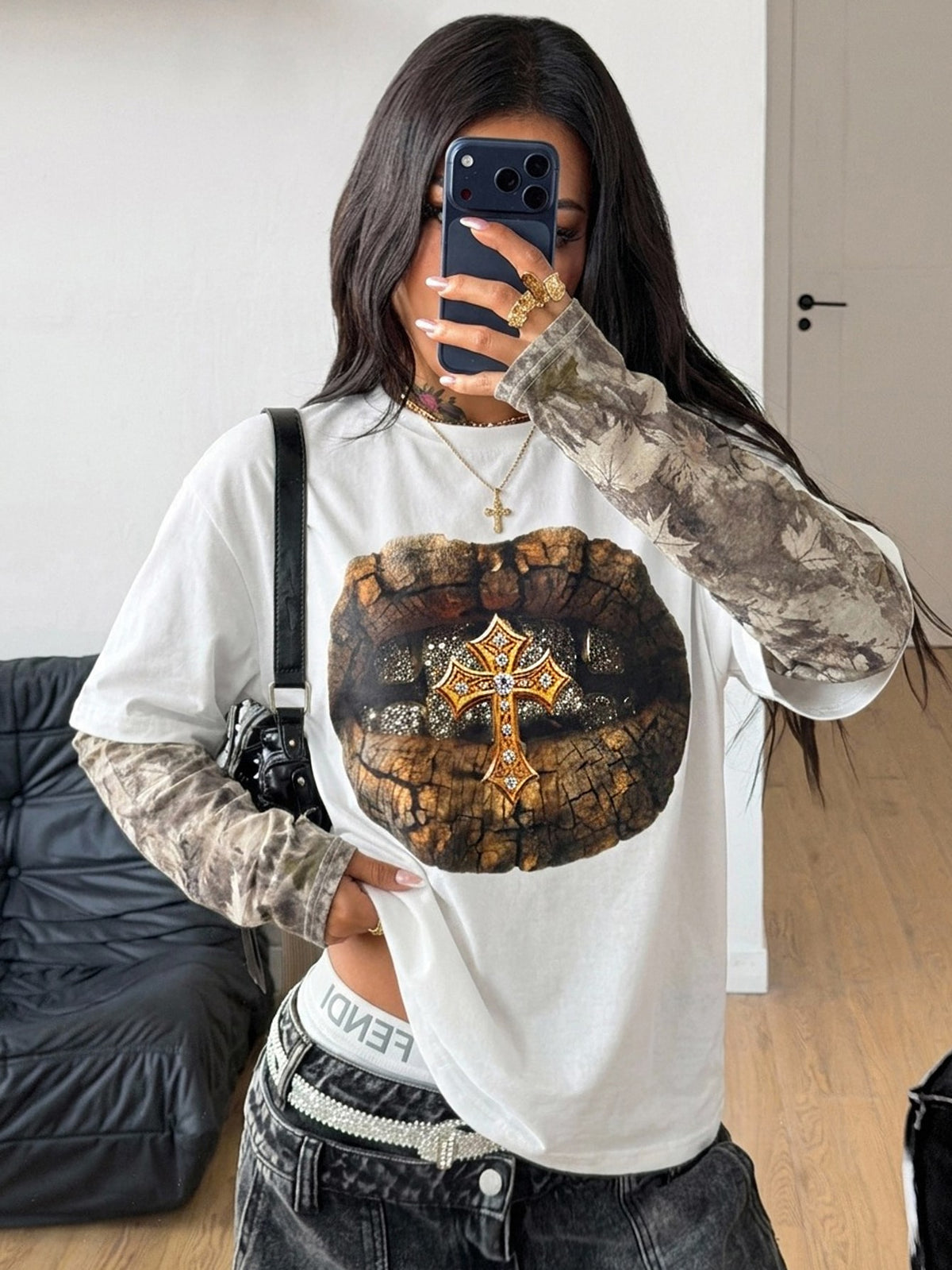 Women's casual graphic long sleeve t-shirt with a round neck, drop shoulder sleeves, and loose relaxed fit.