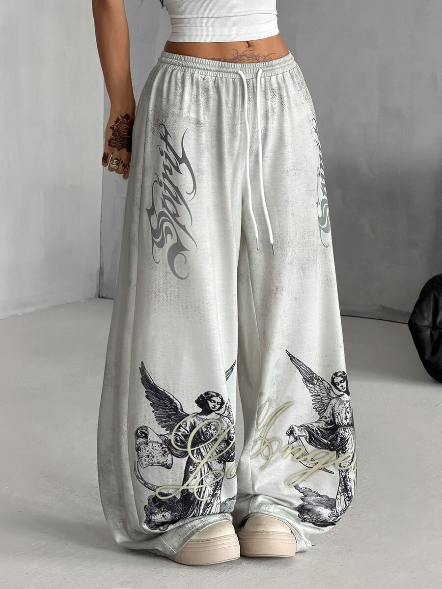 Women's loose fit wide leg graphic sweatpants in light grey with an elastic drawstring waistband