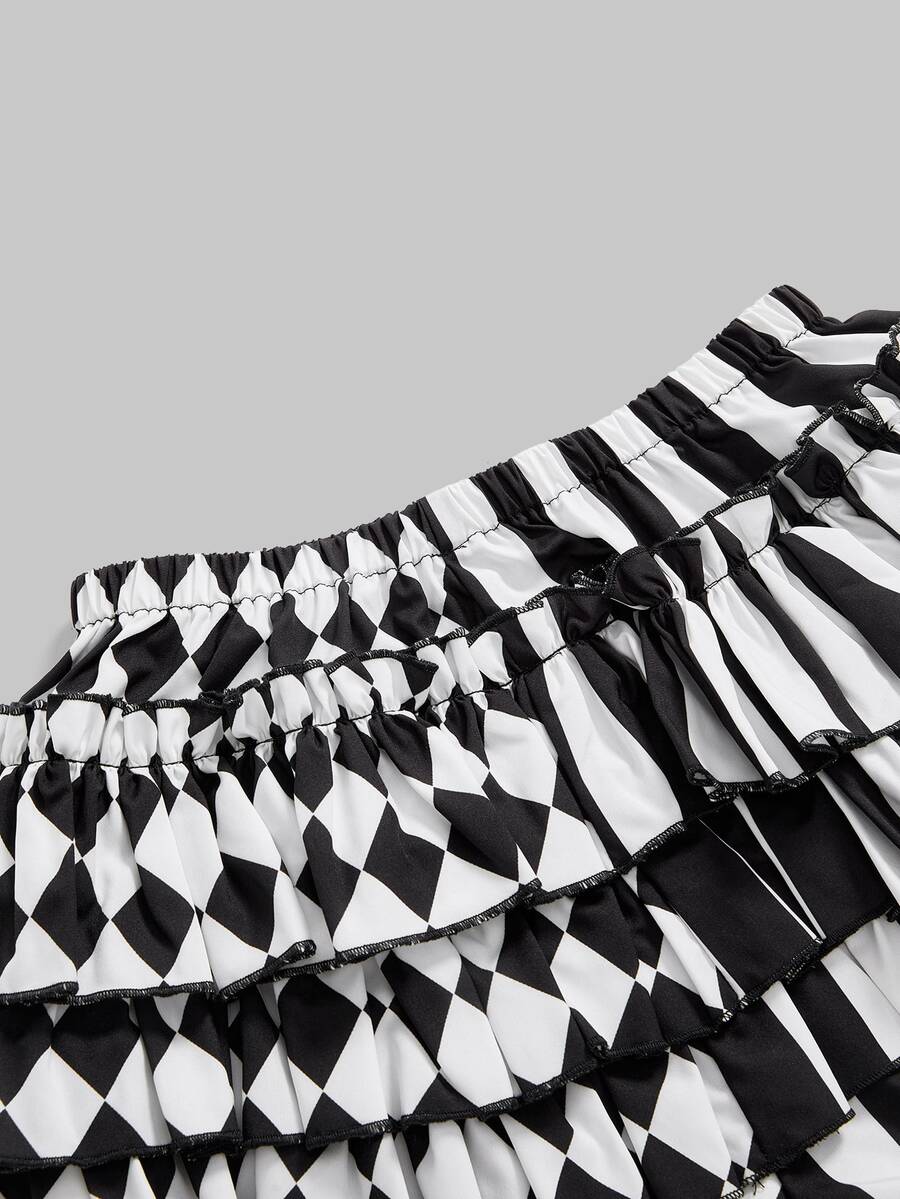 Black and white striped and geometric patchwork gothic pumpkin shorts for women featuring tiered ruffle hems and an elastic waistband.