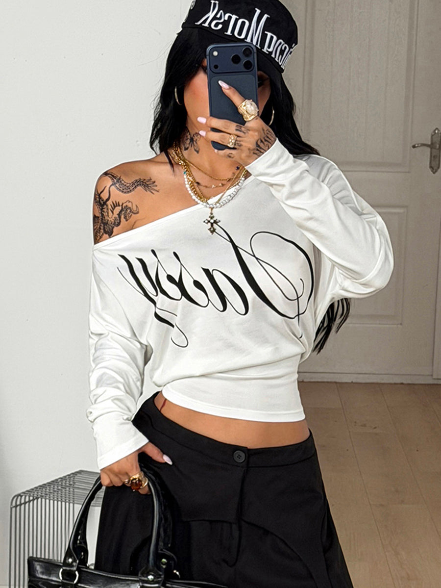 Women's black long sleeve t-shirt featuring delicate contrast lace details and a boat neckline in a knitted stretch fabric.