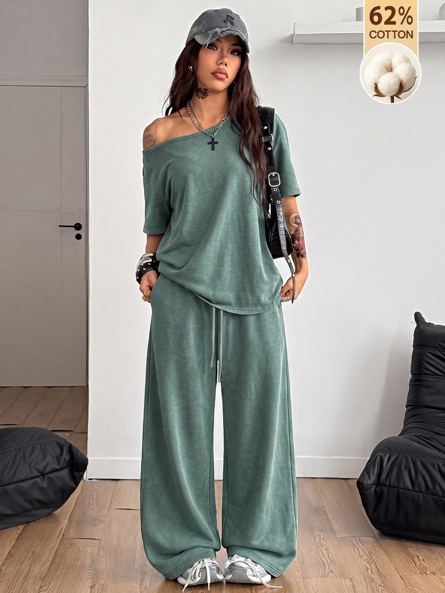 Women's two-piece outfit featuring an oversized asymmetrical neck t-shirt and matching wide-leg drawstring sweatpants.
