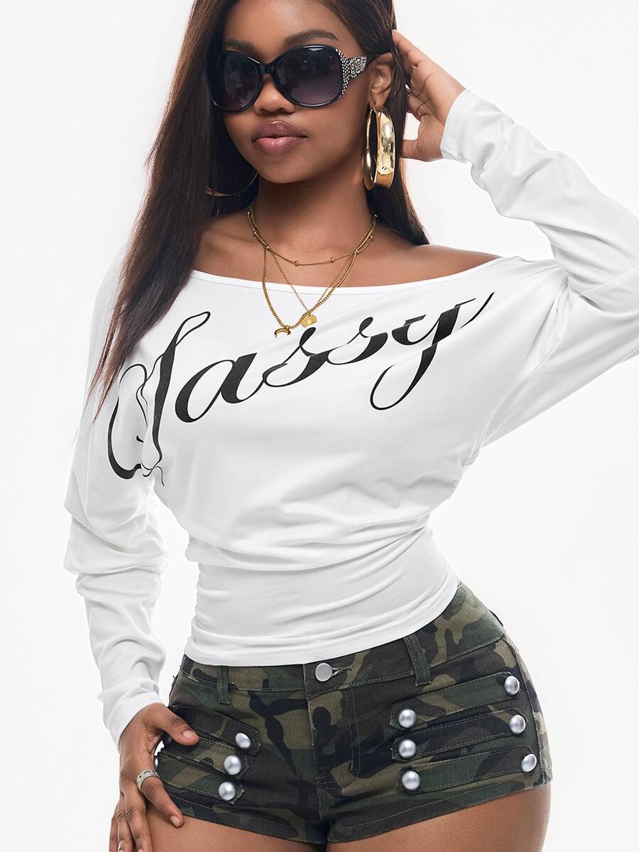 Women's black long sleeve t-shirt featuring delicate contrast lace details and a boat neckline in a knitted stretch fabric.