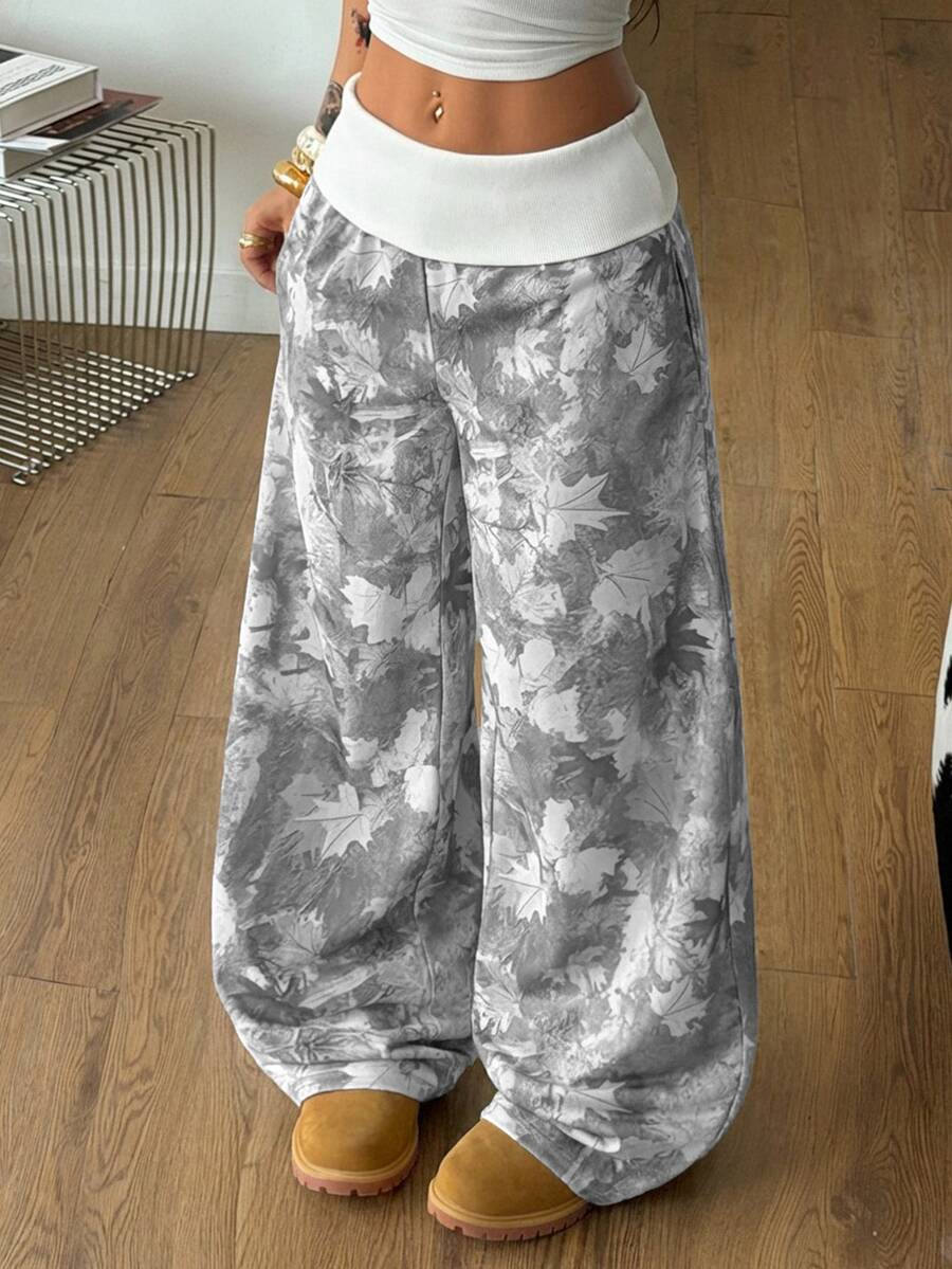 Women's wide leg trousers with a tree branch graphic pattern, loose fit, and mid-rise waist in woven fabric.