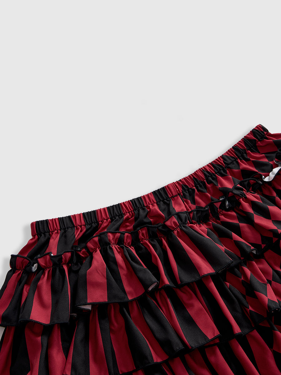 Women's gothic patchwork pumpkin shorts with tiered ruffle hem and geometric striped plaid pattern.