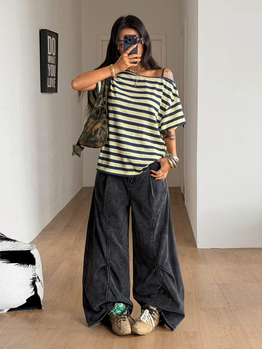 Women's casual loose fit cold shoulder cotton t-shirt with asymmetrical cutout neckline and short sleeves.