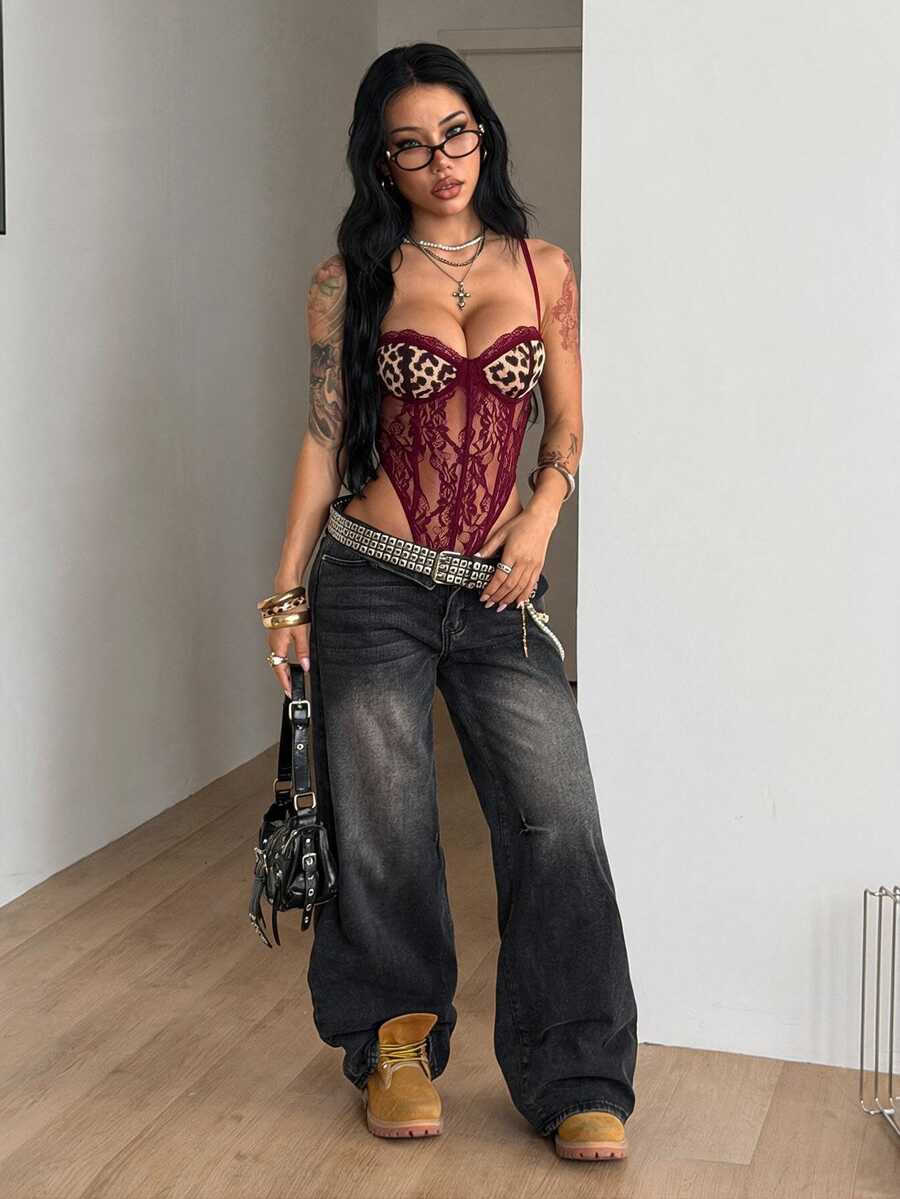 Fitted women's lace and mesh cami bodysuit with spaghetti straps.