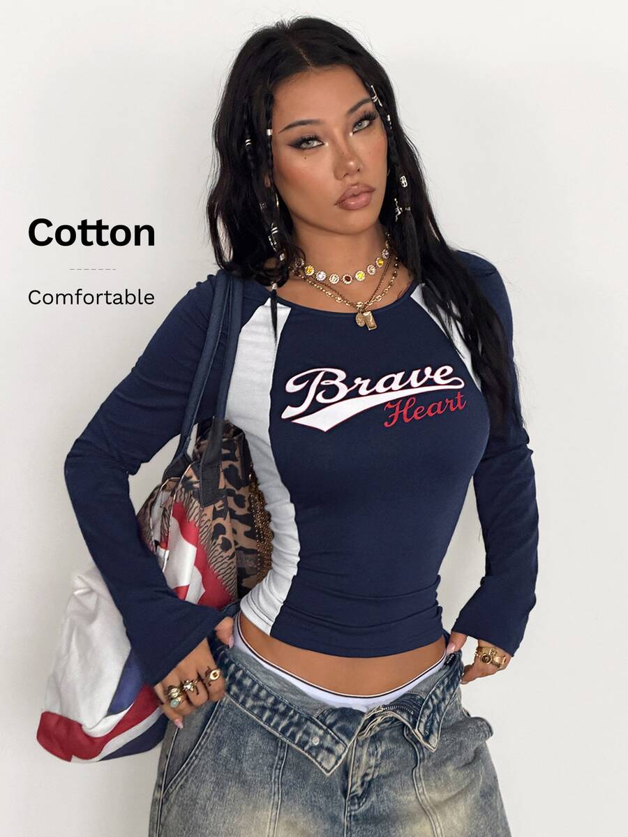 Women's slim fit long sleeve raglan t-shirt with collegiate letter graphic print, round neck, and contrast binding.