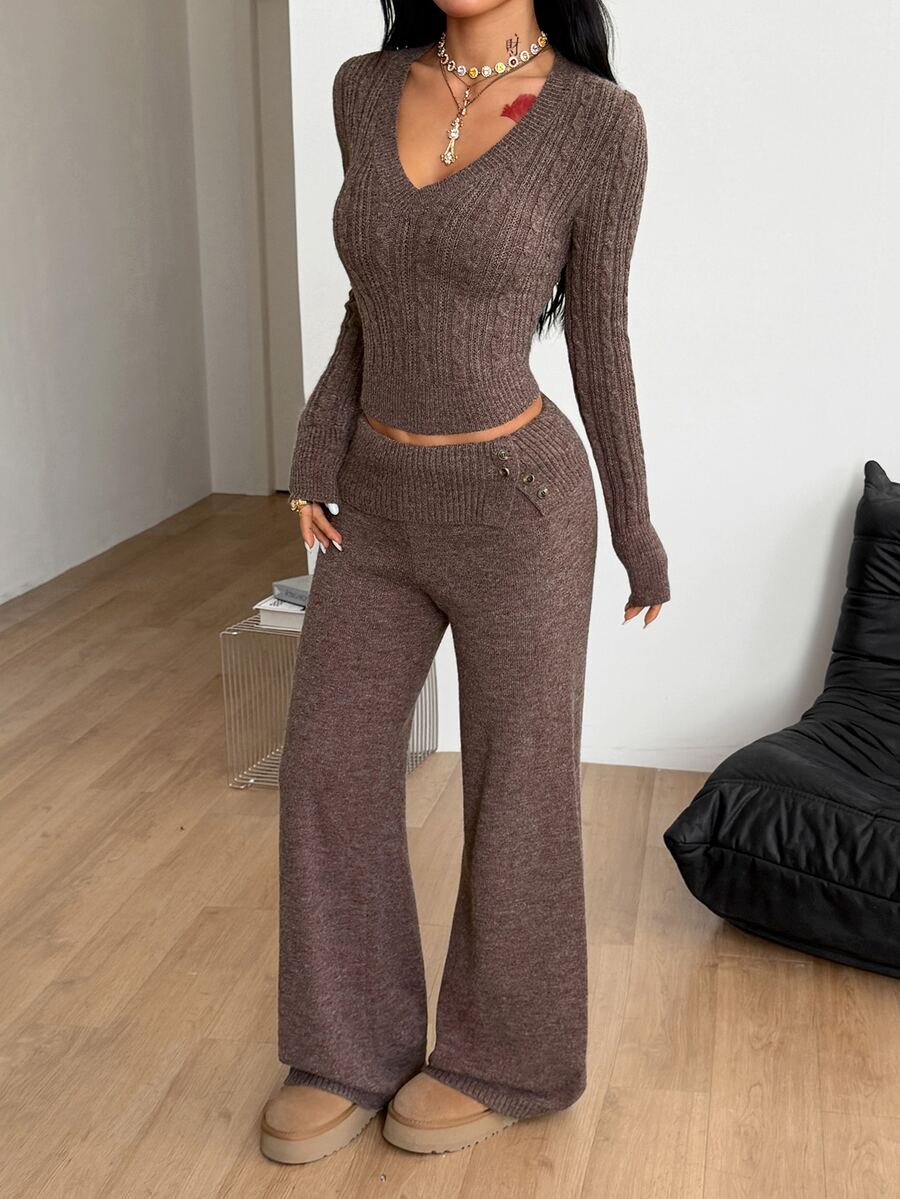 Women's brown ribbed knit two-piece sweater set featuring a long sleeve V-neck top and wide leg flare pants.