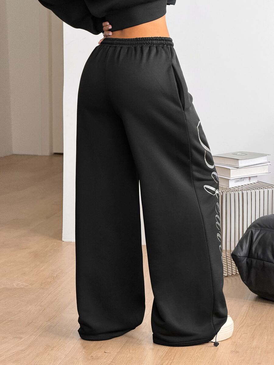 Women's wide leg trousers with a tree branch graphic pattern, loose fit, and mid-rise waist in woven fabric.