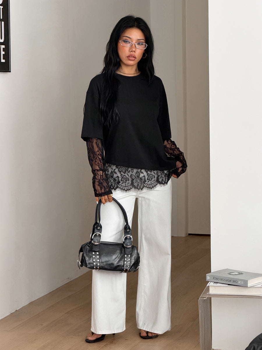 Women's casual graphic long sleeve t-shirt with a round neck, drop shoulder sleeves, and loose relaxed fit.