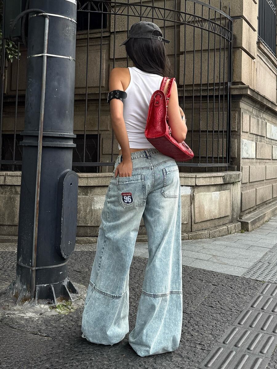 Women's loose wide-leg jeans in light wash denim with low waist and extra-long relaxed fit