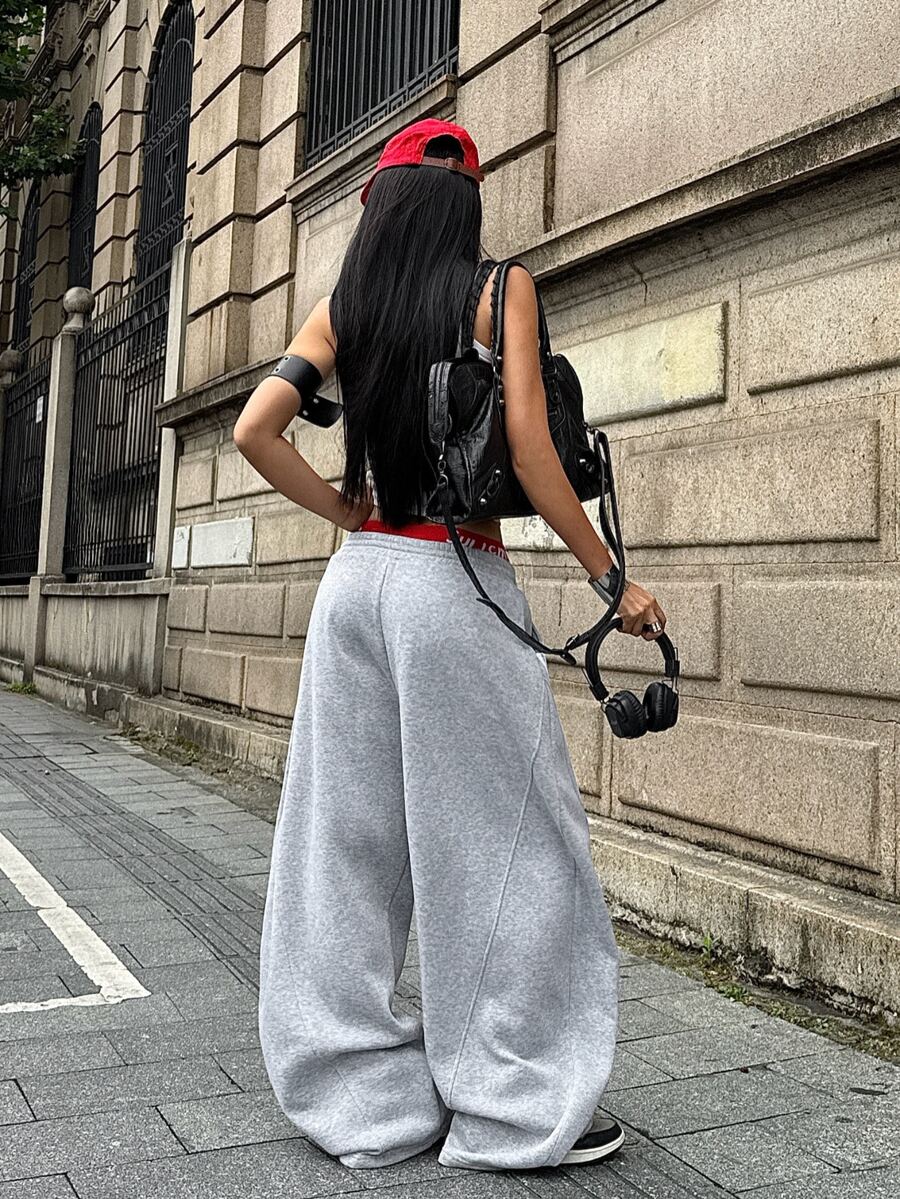 Women's casual grey plaid sweatpants featuring an elastic drawstring waistband, side pockets, and a relaxed loose fit.