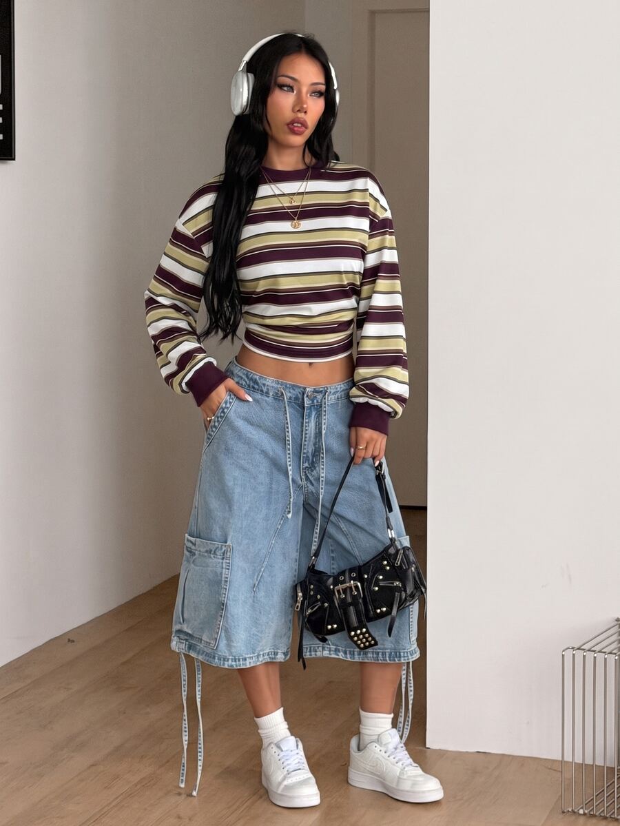 Women's striped pullover sweatshirt featuring drop shoulder long sleeves and a classic round neckline.