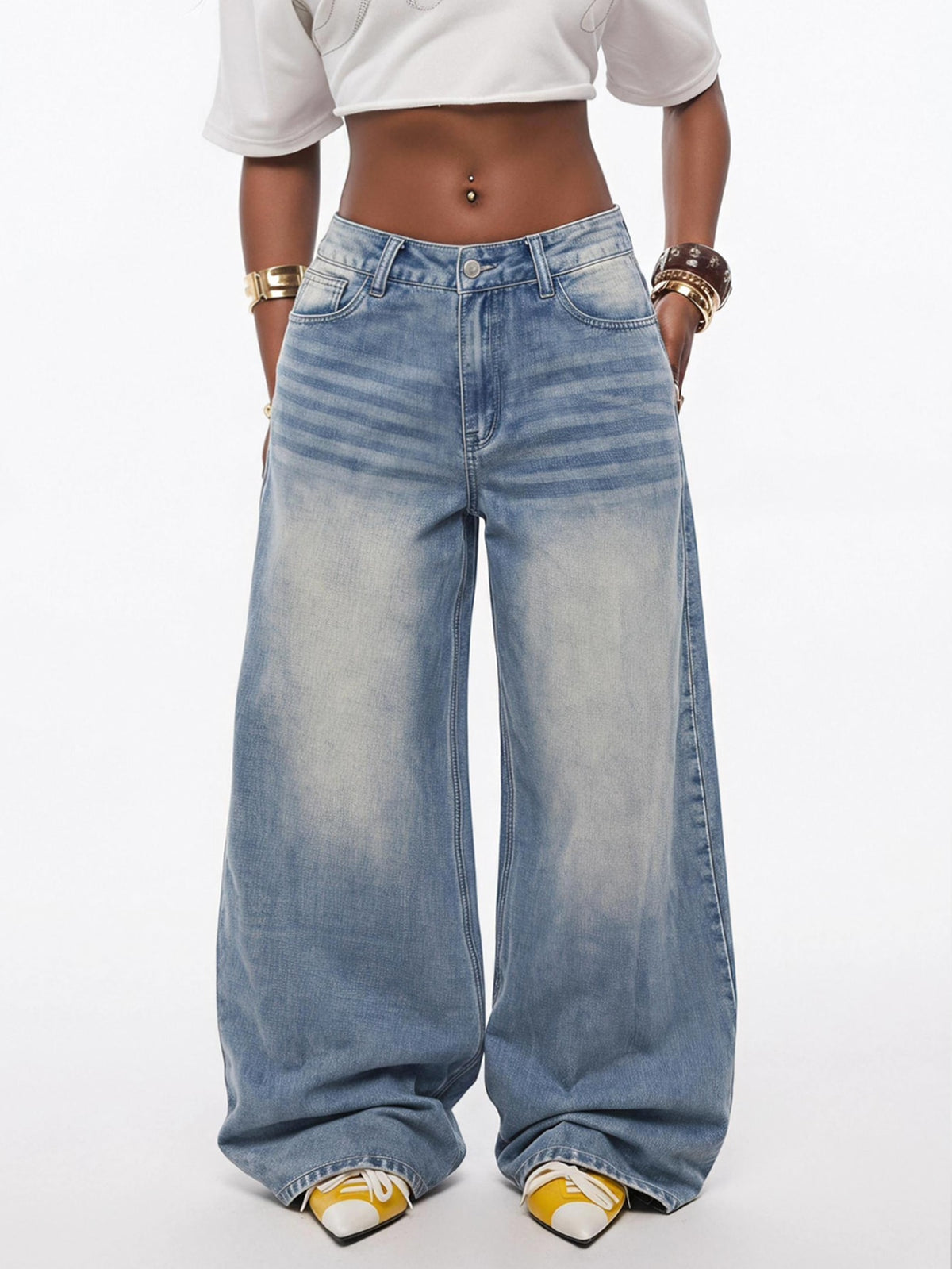 Loose wide leg denim jeans for women featuring a low waist, functional pockets, zipper fly closure, and extra long relaxed fit.