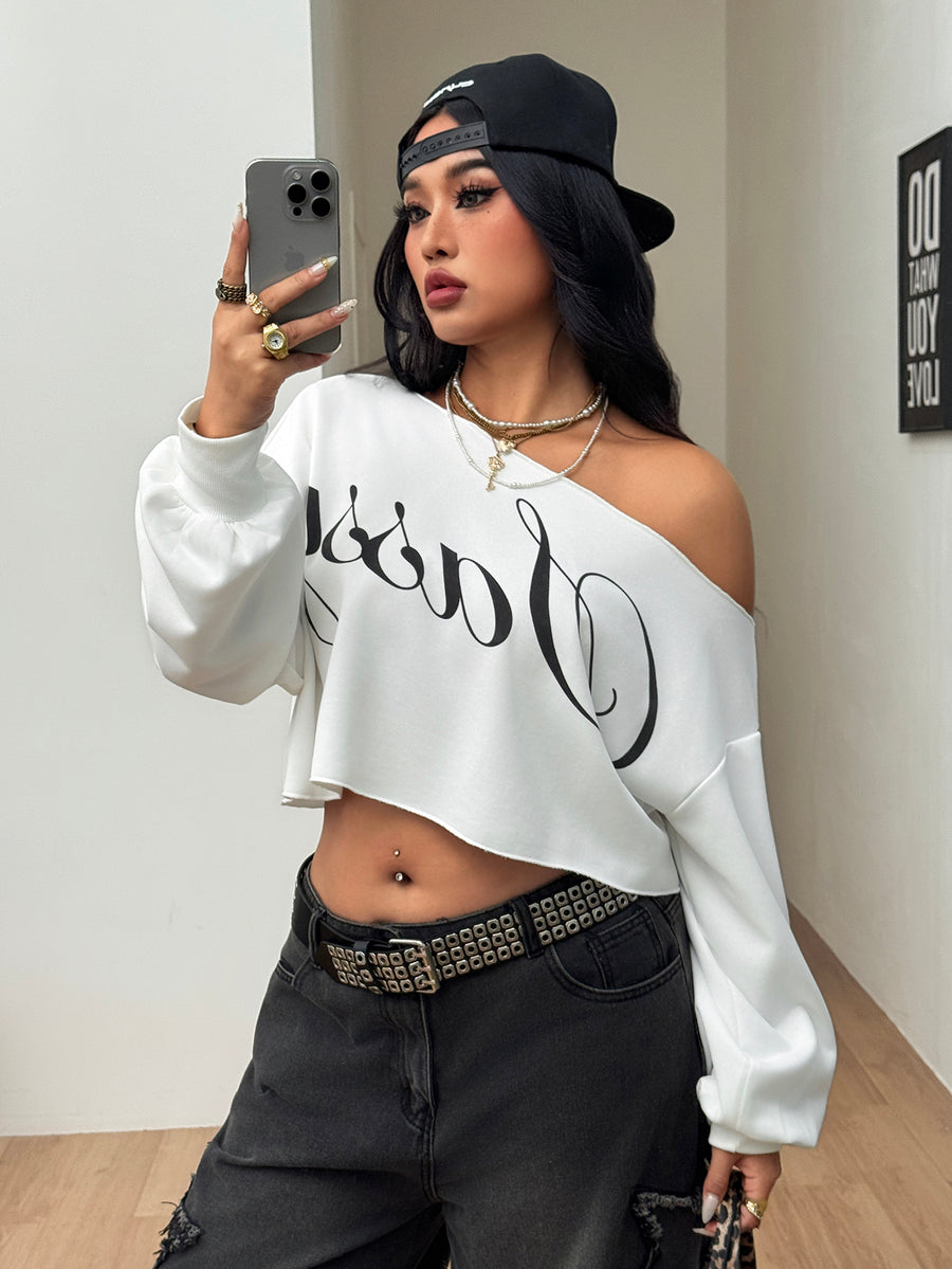 Plus size women's cropped leopard print sweatshirt featuring an asymmetrical neckline and long drop-shoulder sleeves.