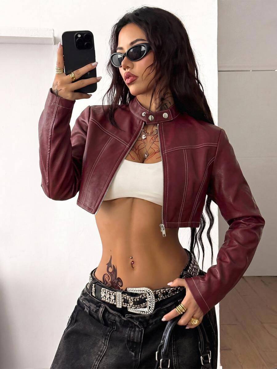 Front view of a women's black cropped PU leather jacket featuring a stand collar, long sleeves, and front zipper closure.