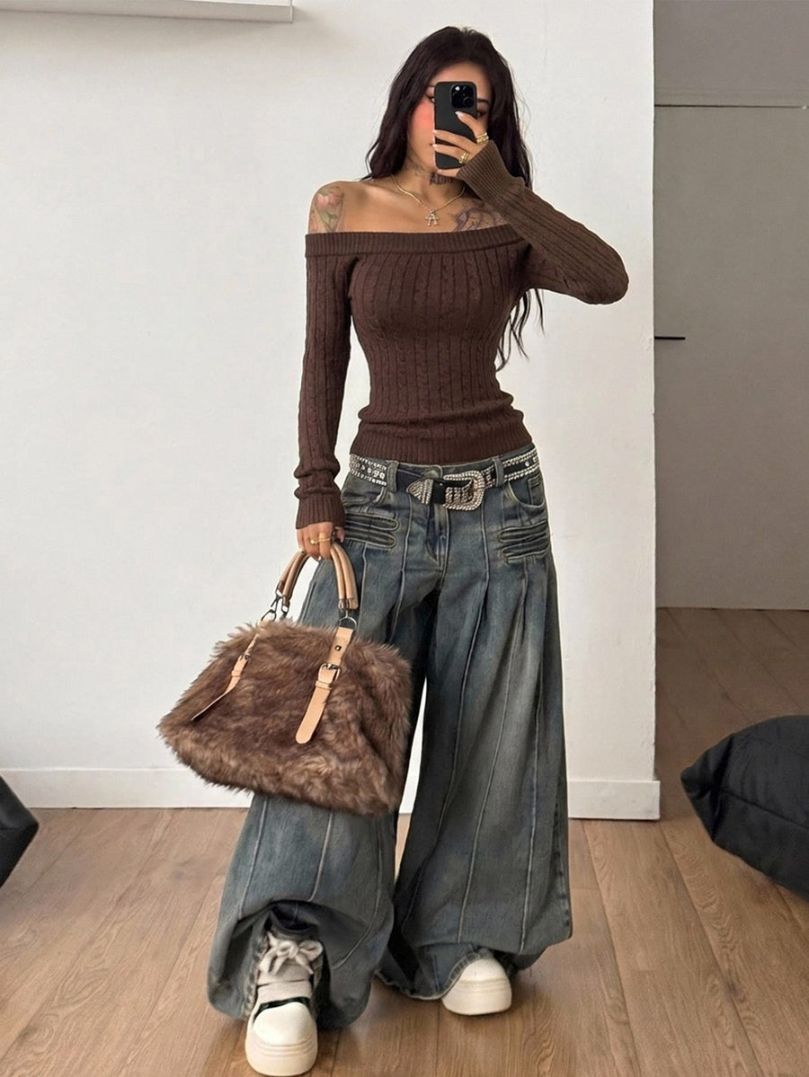 Front view of a women's brown off-the-shoulder sweater with cable-knit detailing and three-quarter sleeves