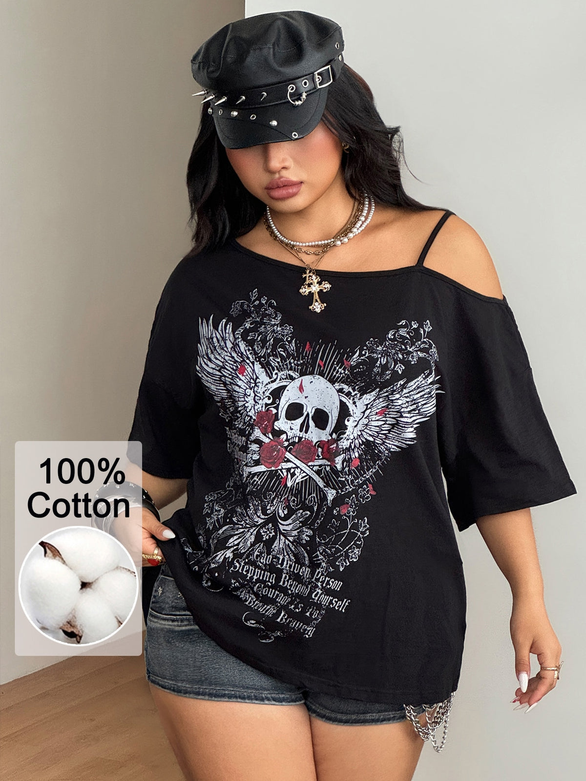 Women's loose-fit black cotton oversized t-shirt featuring an asymmetrical cold shoulder cutout neckline and short drop-shoulder sleeves.