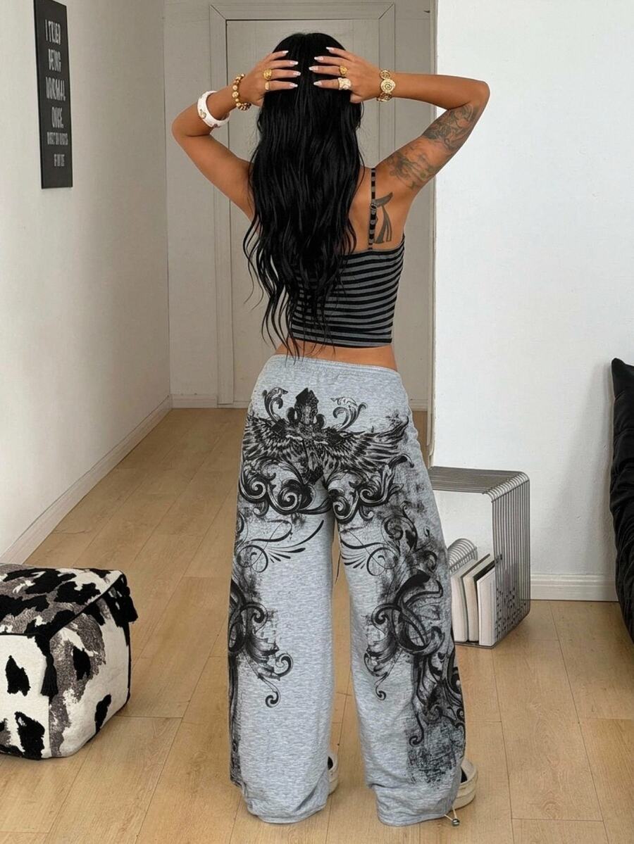 Women's loose fit wide leg graphic sweatpants in light grey with an elastic drawstring waistband
