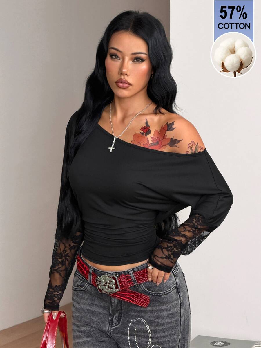 Women's black long sleeve t-shirt featuring delicate contrast lace details and a boat neckline in a knitted stretch fabric.