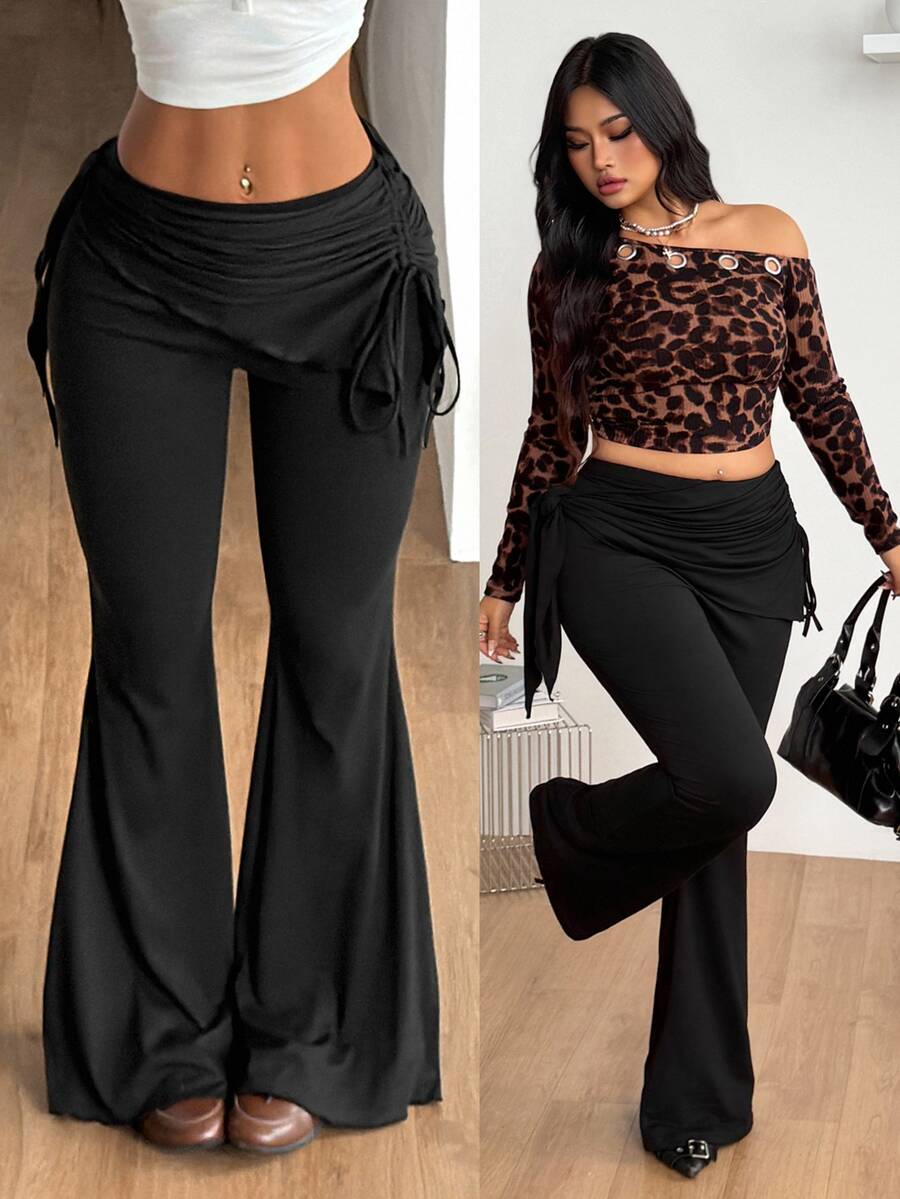 Women's striped flare leg pants featuring a mid-rise waist, slim fit thigh, and ruched side drawstring detail in stretch knit fabric.