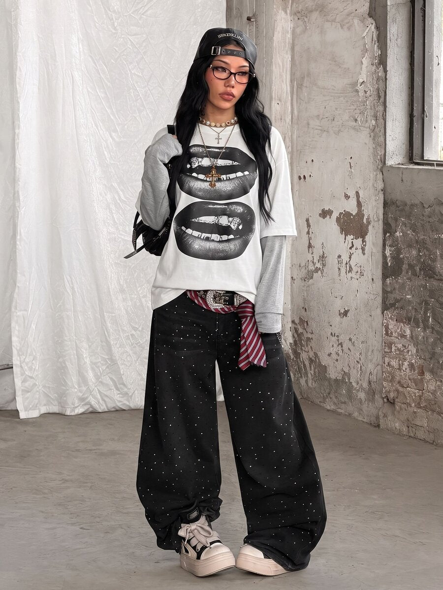 Women's casual graphic long sleeve t-shirt with a round neck, drop shoulder sleeves, and loose relaxed fit.