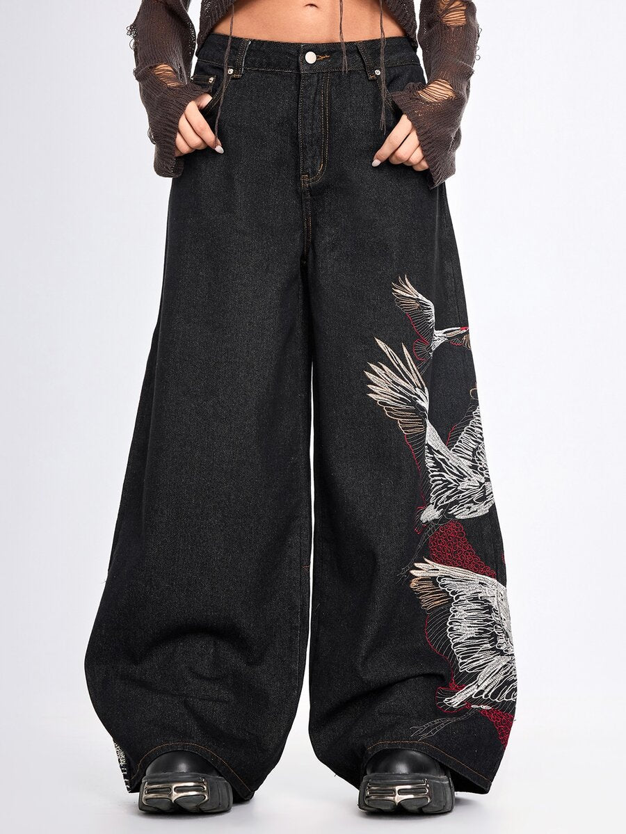 Women's black loose wide leg jeans with detailed crane and landscape embroidery, zipper fly, and ultra low waist.