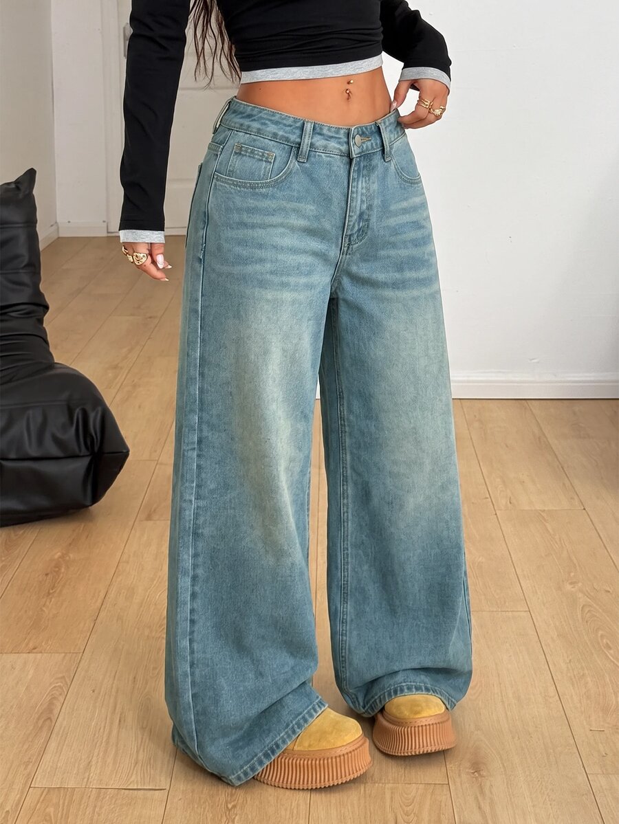 Women's loose wide-leg jeans in light wash denim with low waist and extra-long relaxed fit