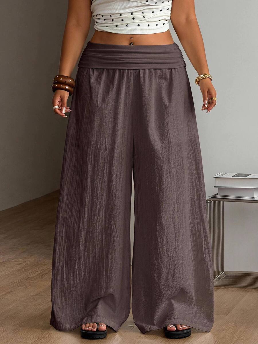 Women's plus size wide leg cotton pants featuring a relaxed loose fit and high waist design.
