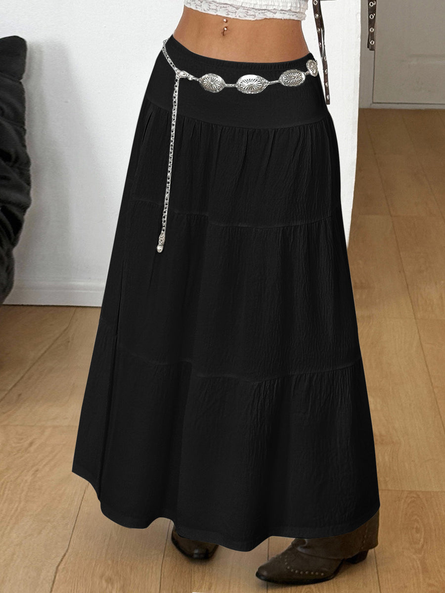 Women's red plaid long skirt featuring a low-rise waist and a side slit in lightweight woven fabric.