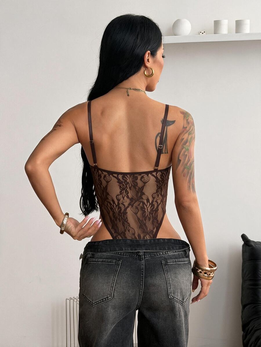 Fitted women's lace and mesh cami bodysuit with spaghetti straps.