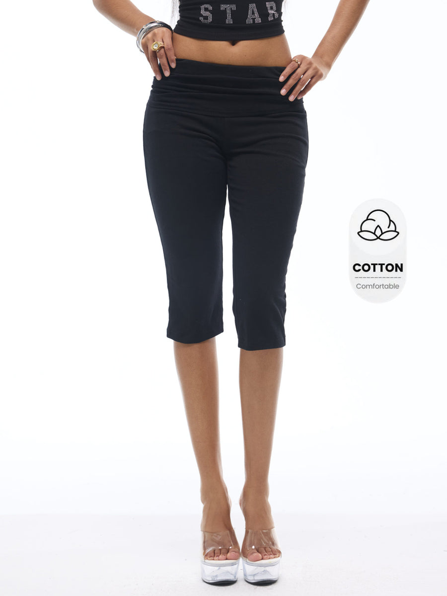 Women's black capri pants with an elastic waistband crafted in a stretchy cotton-blend knit fabric