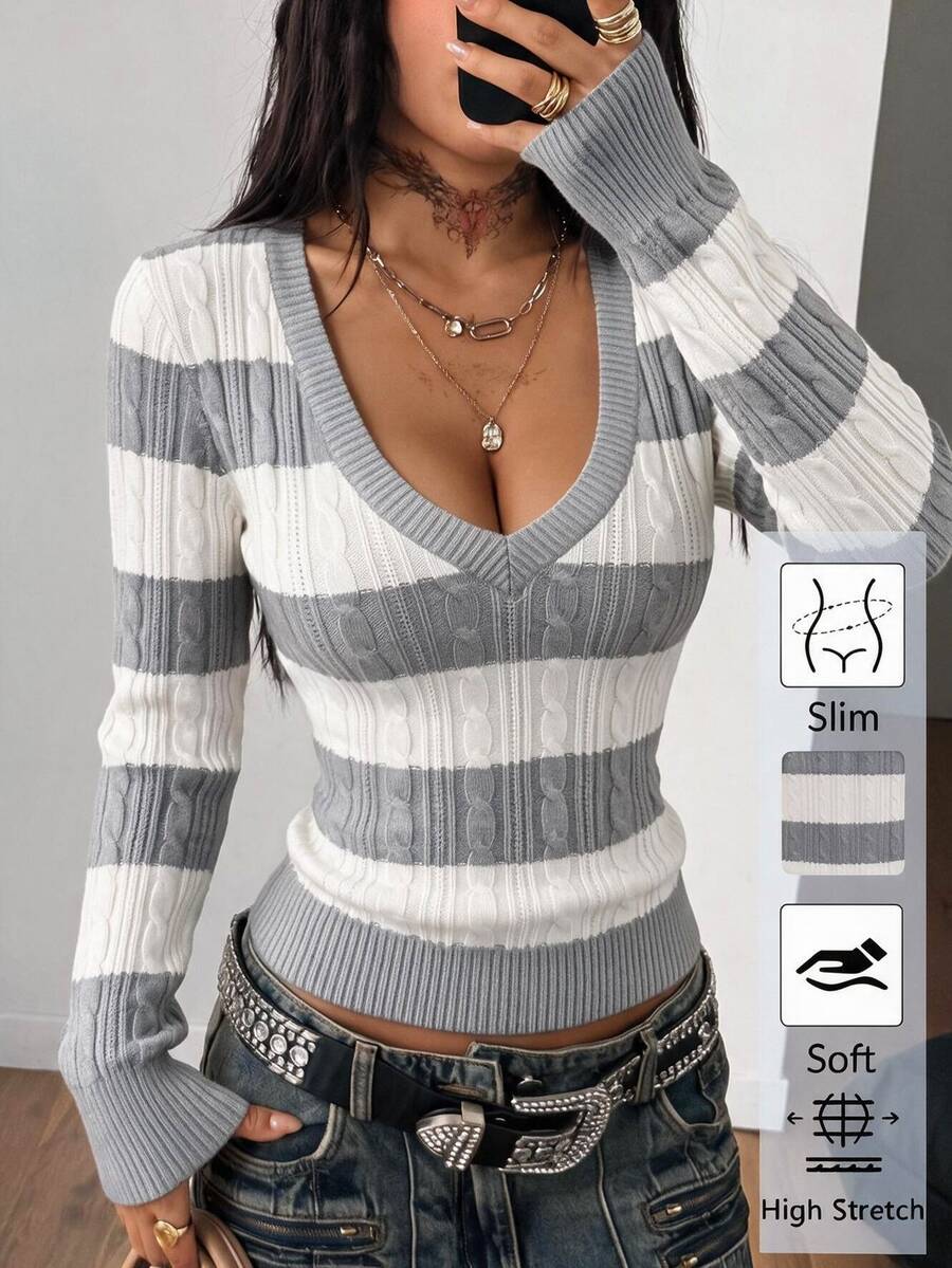 Women's slim fit cable-knit sweater with a V-neckline and long sleeves in solid green rib knit fabric.