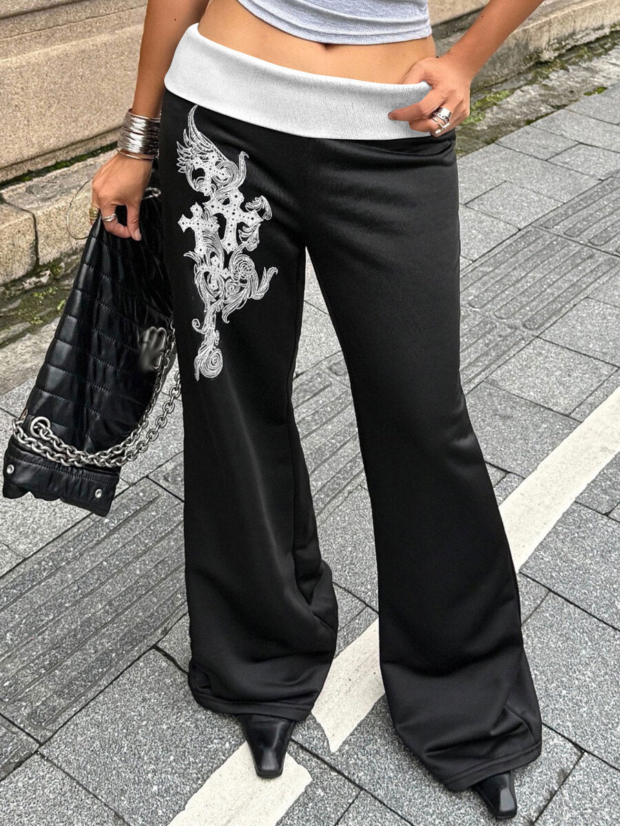 Women's black low waist wide leg flare sweatpants with rib-knit texture and contrast binding details.