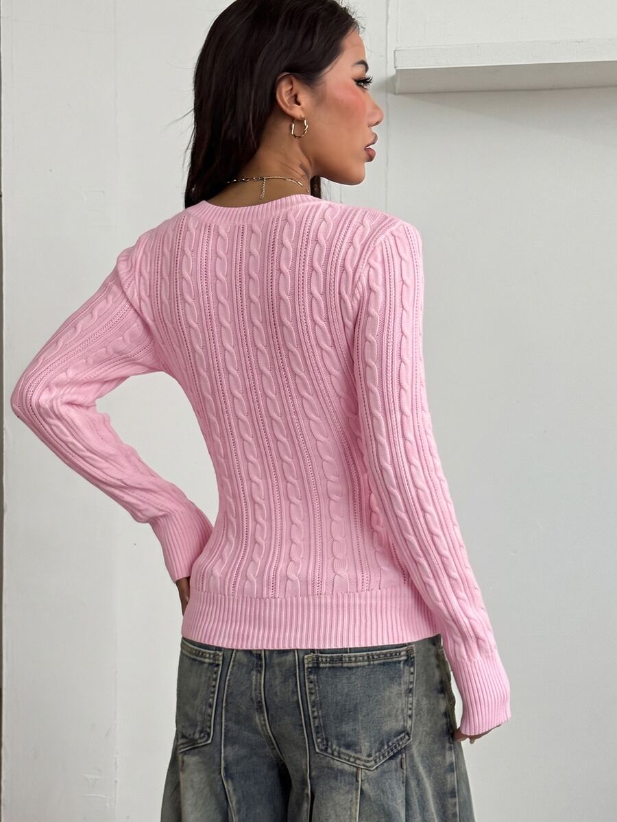 Women's slim fit cable-knit long sleeve sweater featuring a V-neckline and ribbed knit details.