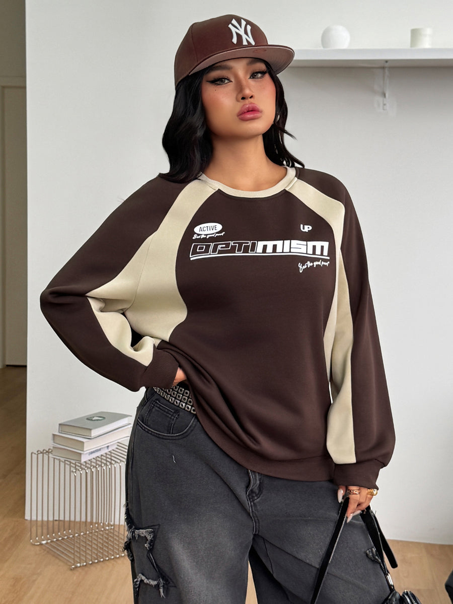 Color-blocked loose pullover sweatshirt with a round neckline, raglan sleeves, and ribbed knit trim.
