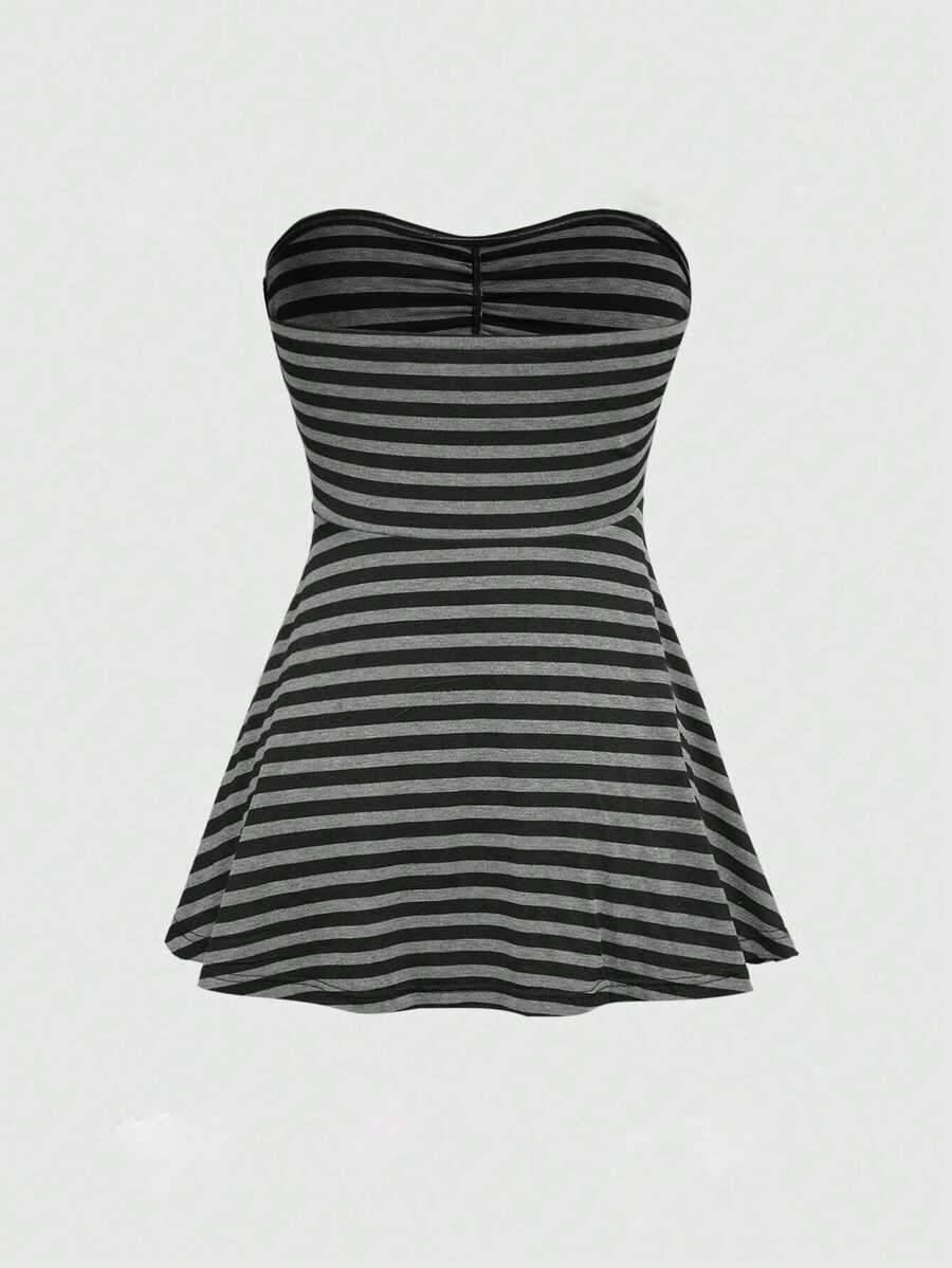 Women's striped strapless tube top featuring ruched detailing, flared hem, and stretchy knit fabric.
