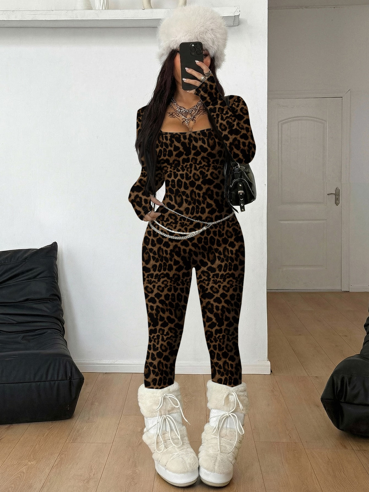 Black square neck long sleeve sport jumpsuit in rib-knit fabric with slim fit unitard silhouette for women.
