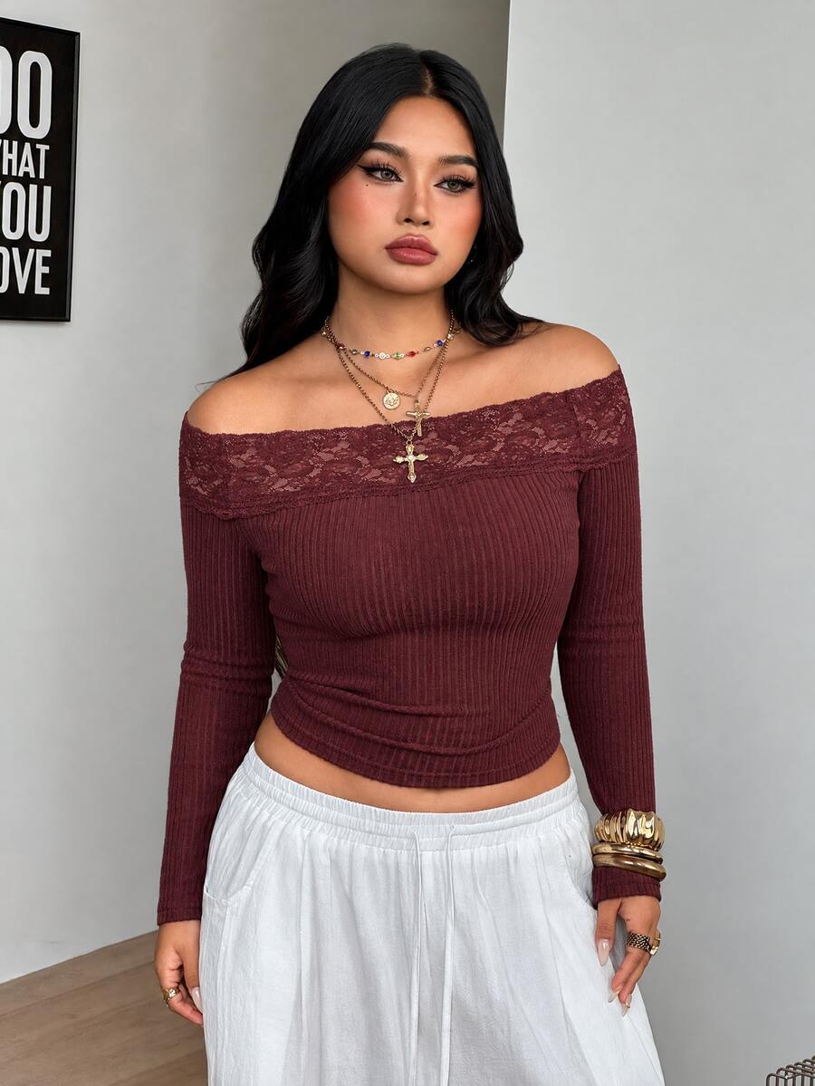 Women's striped off the shoulder long-sleeve top with contrast lace trim and ribbed knit texture.