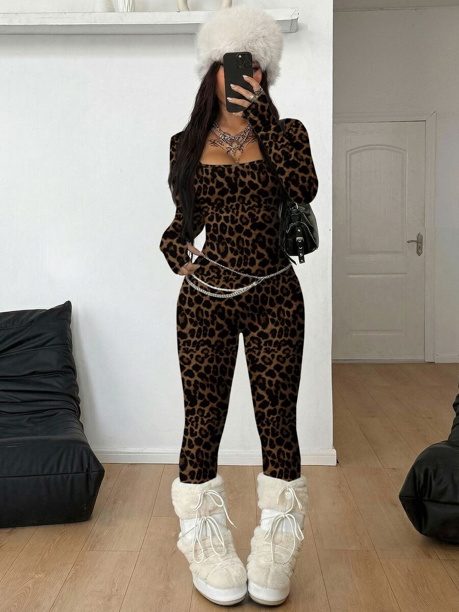 Black square neck long sleeve sport jumpsuit in rib-knit fabric with slim fit unitard silhouette for women.