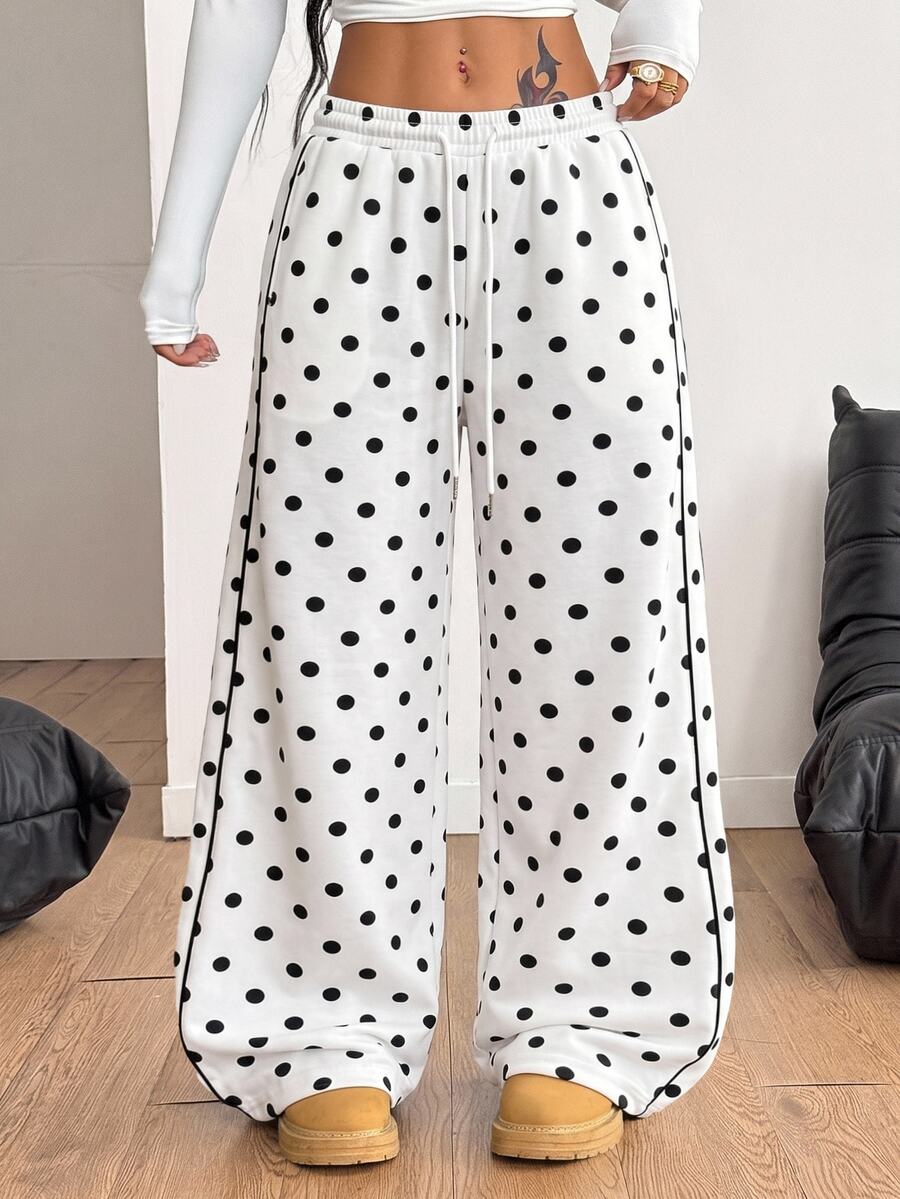Women's loose fit wide leg graphic sweatpants in light grey with an elastic drawstring waistband