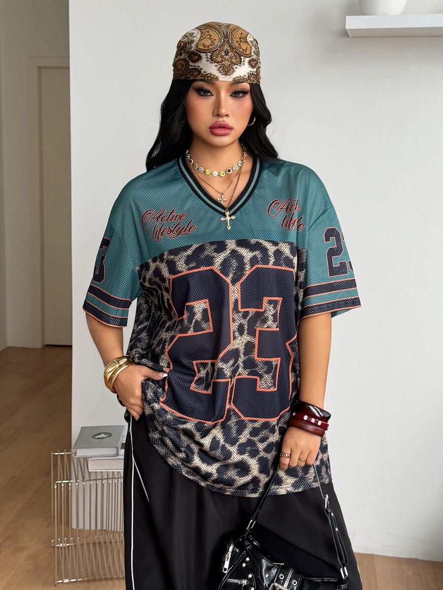 Navy blue plus size mesh baseball jersey t-shirt featuring a V-neck, raglan half sleeves, and sporty letter detailing.