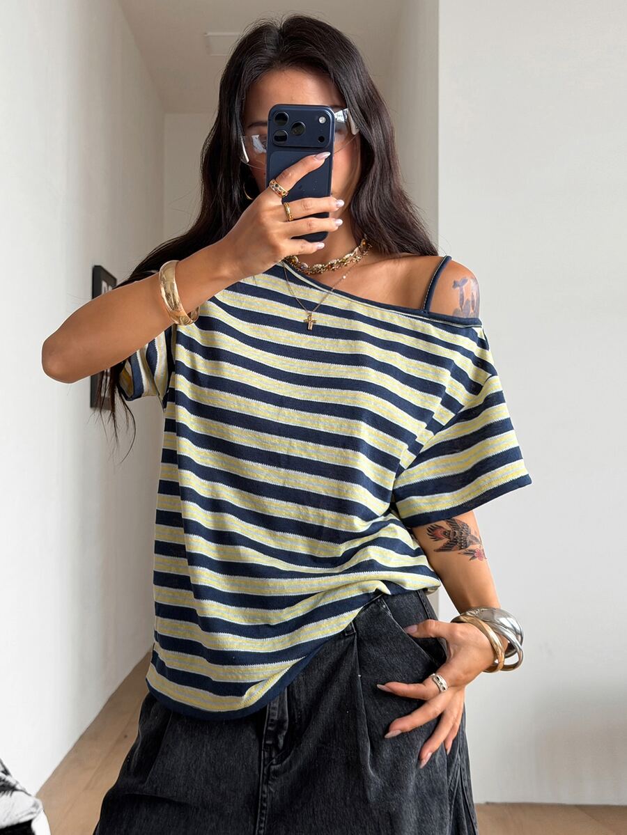 Women's casual loose fit cold shoulder cotton t-shirt with asymmetrical cutout neckline and short sleeves.