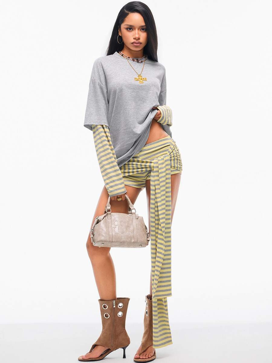 Women's casual graphic long sleeve t-shirt with a round neck, drop shoulder sleeves, and loose relaxed fit.