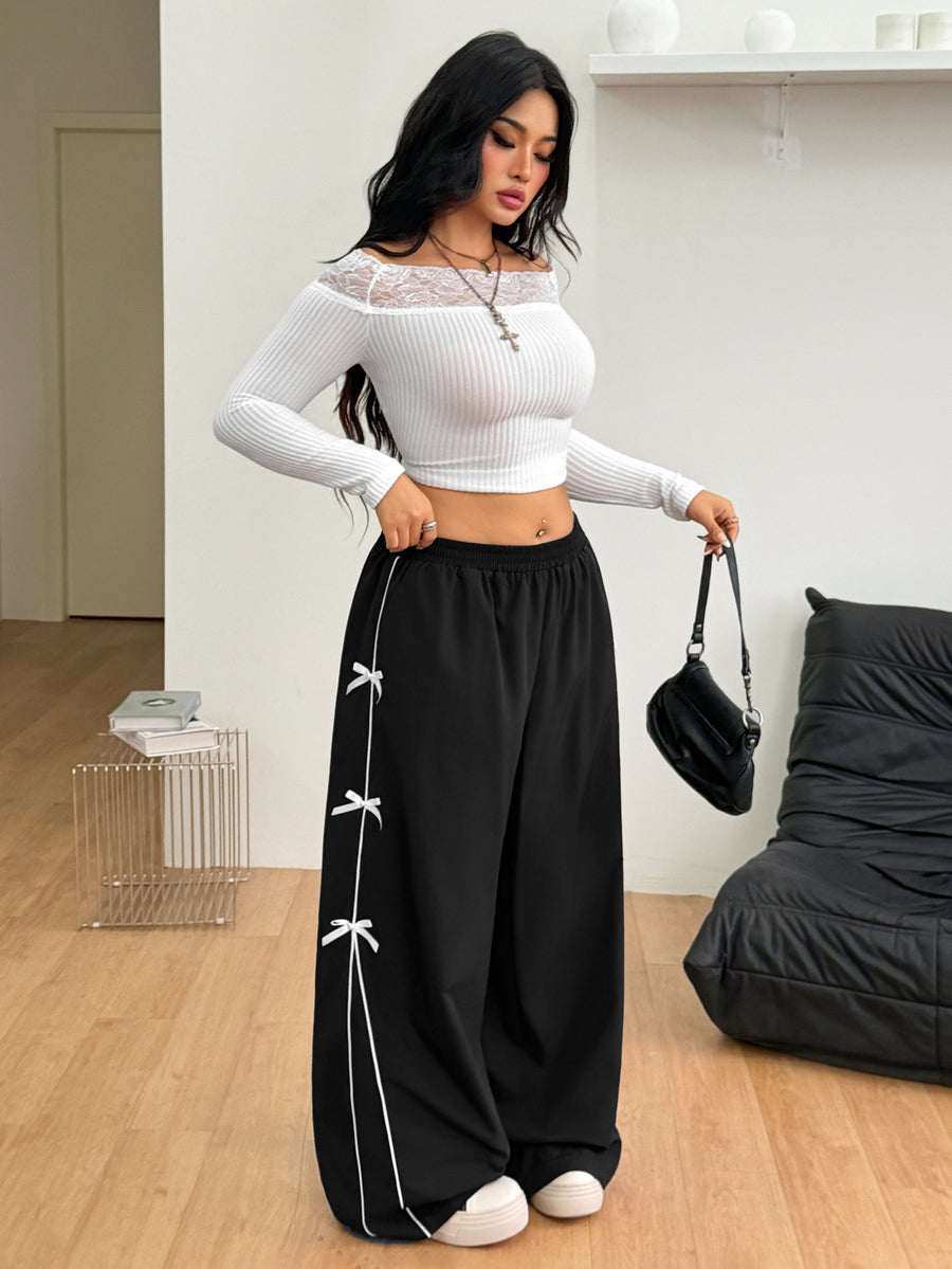 Plus size loose straight leg casual pants with elastic drawstring waist, contrast binding, and side pockets.