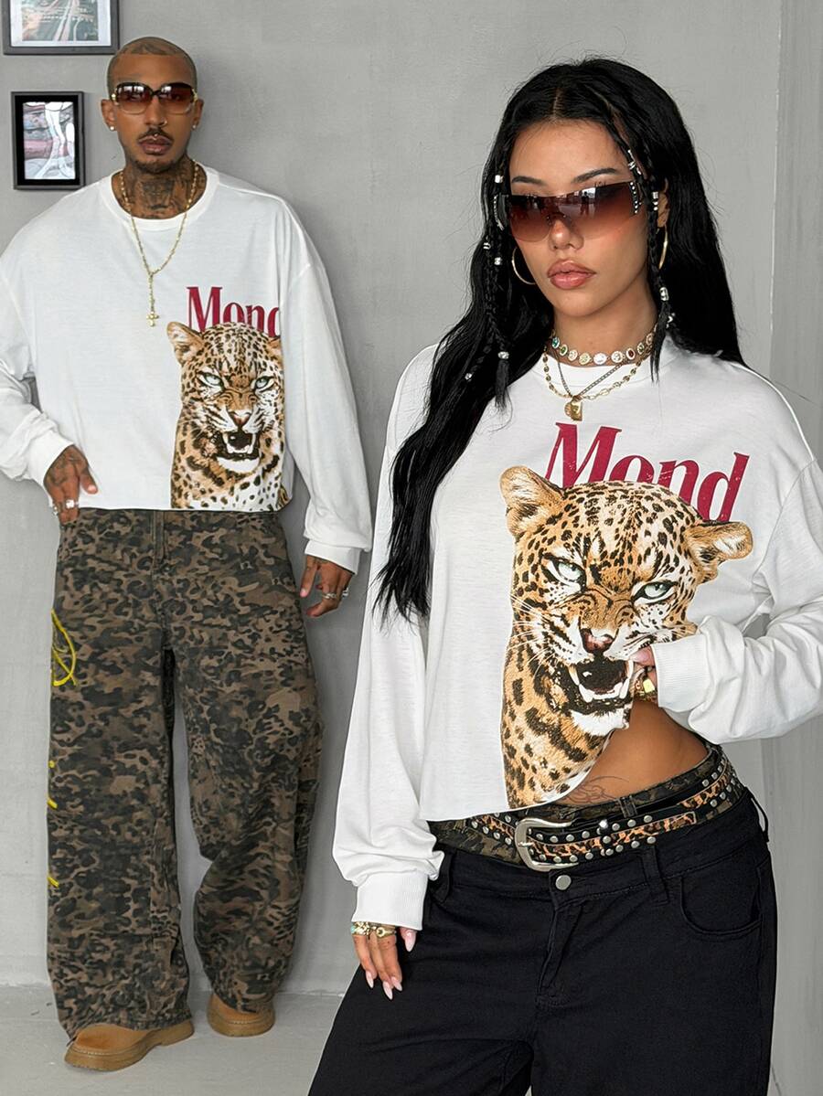 Women's white oversized long sleeve graphic T-shirt with drop shoulders and a round neckline.