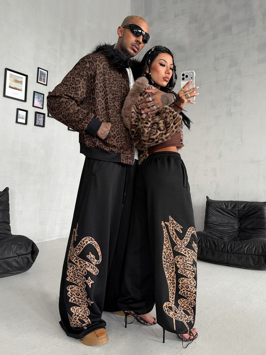 Women's loose fit wide leg graphic sweatpants in light grey with an elastic drawstring waistband